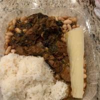 Cordero Trujillano · Northern Peruvian style lam with beans, cassava, and rice, served with onion salad.