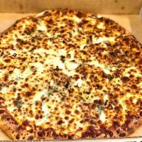 Greek Pizza · Oregano, fresh basil, fresh garlic, mozzarella, parmesan and feta cheese. No sauce.