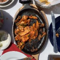 Chicken Fajita · Grilled marinated chicken with onions, zucchini, peppers, mushrooms and fresh tomatoes. Serv...