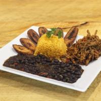 Ropa Vieja · Cuban style shredded beef served with yellow rice, sweet plantains and black beans.