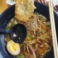 Shoyu Ramen · A beef and vegetable stock based broth resulting in a salty flavor from the shoyu 