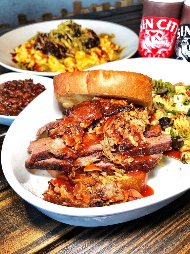 Brisket Sandwich · Texas toast, side of appropriate slaw and pickled jalapeno garnish.
