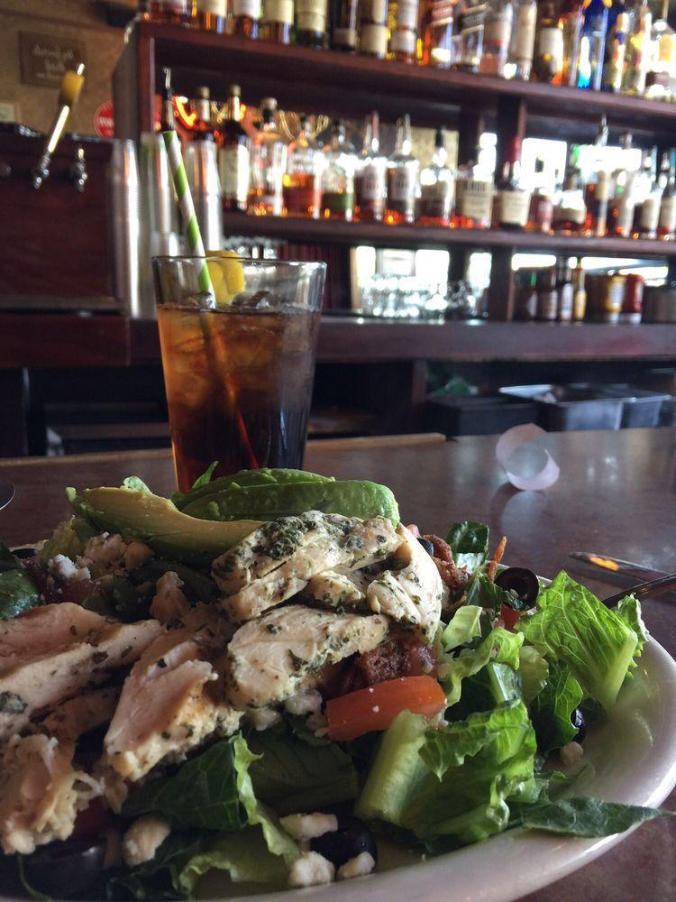 Cobb Salad · Grilled chicken on romaine, tomatoes, olives, bacon, bleu cheese crumbles, avocado and bleu cheese dressing.