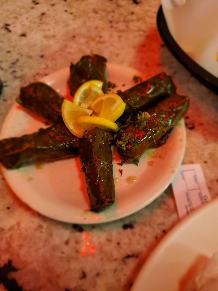 Dolmas · Tender grape leaves stuffed with rice, spices and herbs in olive oil.