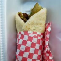 Falafel Sandwich · Famous and authentic. Fresh ground chick peas with herbs and spices. Fried until golden brow...
