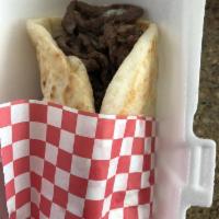 Greek Gyro · Hand sliced. Beeef and lamb seasoned with Greek spices and topped with tzatziki sauce, tomat...