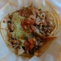 Super Taco · Whole pinto Beans, fresh salsa, cheese, sour cream, guacamole, and your choice of meat.