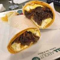 Bulgogi Breakfast Wrap · A breakfast wrap made fresh with Korean marinated grade a beef sautéed with yellow onions an...