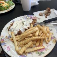 Chicken Fried Steak · 6 oz chicken fried steak with bacon infused gravy.   Served with mashed potatoes and green b...