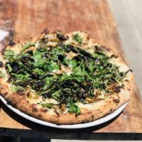 Truffle Pizza · Cashew cream, wild mushrooms, tuscan kale, lemon vinaigrette.