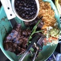 Carne Asada · A specially prepared skirt steak, flame broiled to your liking. Served with guacamole and pi...