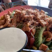 Fajita Salad · Sauteed chicken fajita meat on fresh romaine lettuce, tomatoes, corn, Parmesan cheese and av...