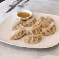 Chicken Momo · Minced chicken marinated with Nepalese spice wrapped in a thin pastry and steamed.