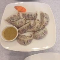 Vegetarian Momo · Mixed vegetables marinated with Nepalese spice wrapped in a thin pastry and steamed served w...
