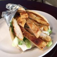 Chicken Shawarma Pita · Marinated grilled chicken breast thinly sliced served with lettuce, tomatoes, onions, tzatzi...