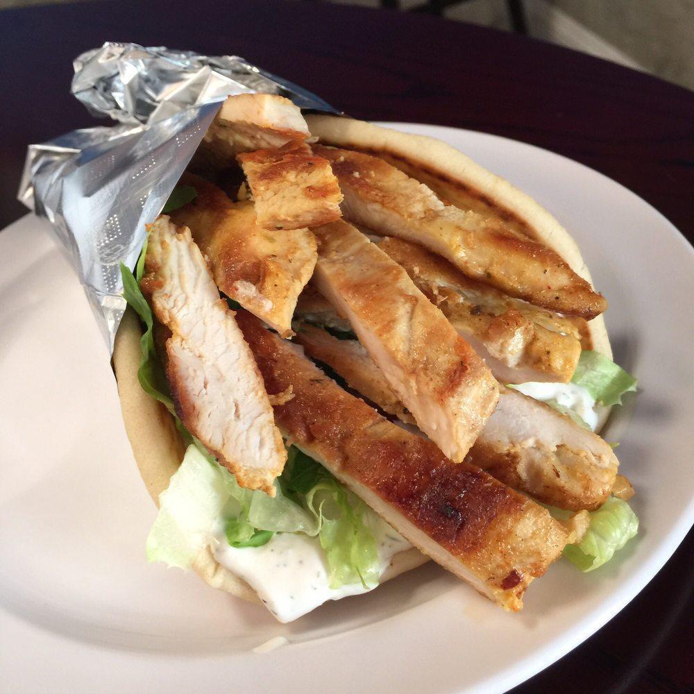 Chicken Shawarma Pita · Marinated grilled chicken breast thinly sliced served with lettuce, tomatoes, onions, tzatziki sauce.