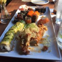 Black and Gold Roll · Temp shrimp, cucumber, crab stick, baked with spicy mayo, crawfish, scallion topped with cru...