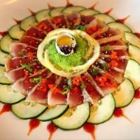 Sunflower · Thin sashimi slices of seared tuna in ponzu, sriracha served with tobiko, masago, scallion, ...