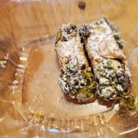 Cannoli · Mini cannolis  with crushed pistachios and chocolate chips.