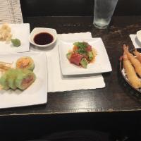 Shrimp Tempura · Fresh shrimp dipped in tempura batter and deep-fried until perfectly crispy. Served with tem...