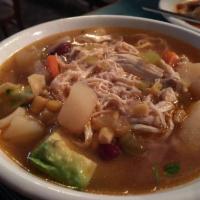 Tortilla Soup · Made with crispy tortilla strips, onions, tomatoes, cilantro, avocado and cheese.