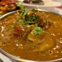 Goat Curry · Goat meat (bone in) spiced mildly in a special brown curry gravy and herbs.