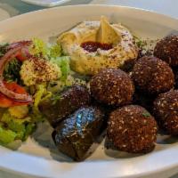 Falafel Plate · 6 pieces of falafel, served with hummus, dolmas, salad and pita bread. Vegetarian.