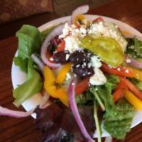 Greek Salad · Romaine lettuce, red onions, tomato, cucumber, peppers, Kalamata olives, feta cheese and pep...