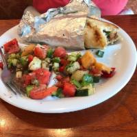 Fattoush Salad · Tomato, cucumber, onion and bell peppers in a garlic herb vinaigrette. Vegan and gluten free.