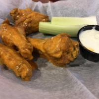 Buffalo Wings · Boneless or traditional wings served with bleu cheese and celery.
