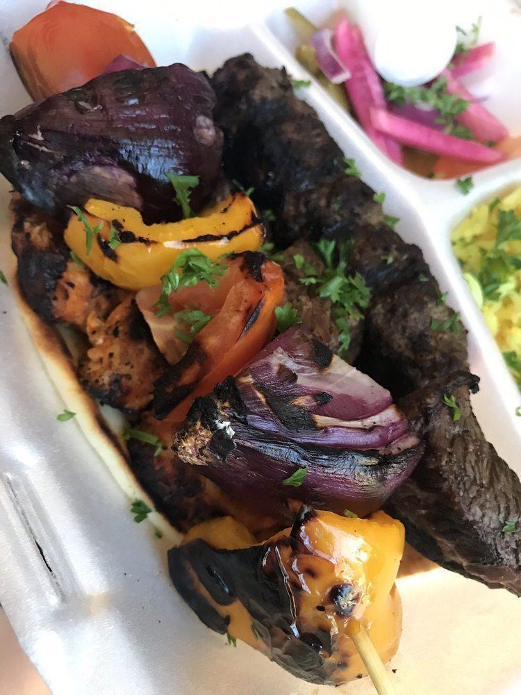 Mixed Grill · Skewer of kafta, Tawook and beef kabab. Served with rice, tahini sauce and garlic sauce.