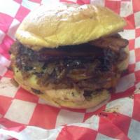 Jack Daniels Burger · Jack Daniels style sauce, caramelized onions tons of bacon, and Swiss cheese!