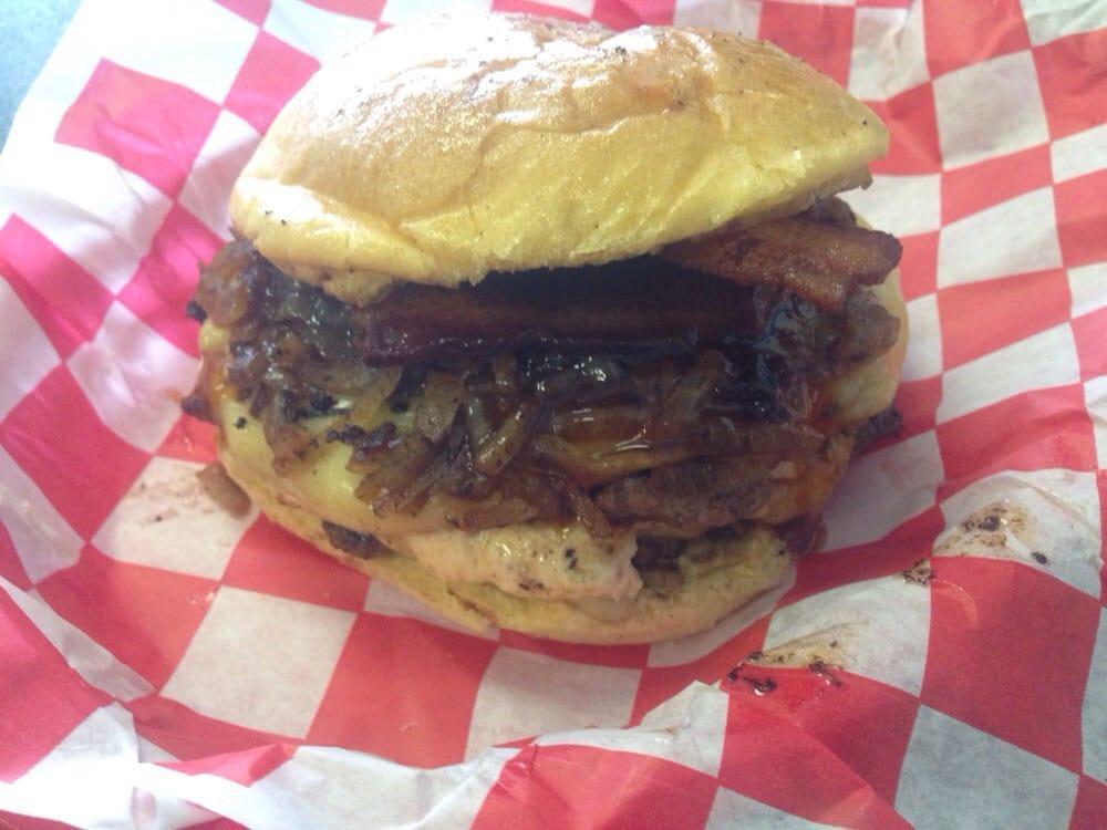 Jack Daniels Burger · Jack Daniels style sauce, caramelized onions tons of bacon, and Swiss cheese!
