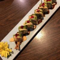 Dragon Roll · Shrimp tempura roll topped with avocado, eel sauce, spicy mayo, masago and sesame seed.