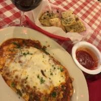 Lasagna · Fresh pasta layered with braised beef, Italian cheeses, and Chianti-braised meat sauce.