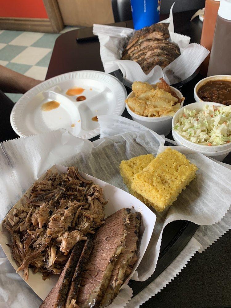 Lil Feast Platter St. Louis · 1/2 slab of St. Louis style Spare Ribs, Pulled Pork, Texas Beef Brisket, 2 sides and 1 cornbread. Feeds 1 generously.