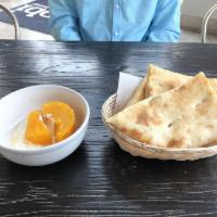 Kaddo Borani Plate · Pan-fried and baked baby pumpkin seasoned with sugar and served on yogurt garlic sauce.