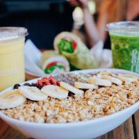 Deluxe Acai Bowl · Our traditional acai bowl topped with banana, granola, chia seeds, hemp seeds, goji berries,...