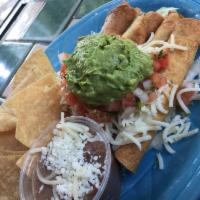 Taquitos · 4 rolled corn tortillas with chicken, crispy fried and topped with cheese, guacamole, sour c...