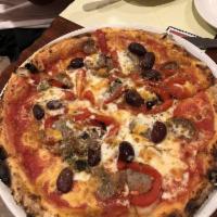 Calabrese Pizza · Tomato sauce, fresh mozzarella, mild Roma sausages, black olives, roasted peppers, oregano a...