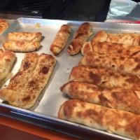 Stromboli · Sausage, pepperoni, green peppers, mushrooms and onions are all rolled up in our delicious N...