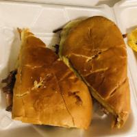 Cuban Sandwich · Big sandwich. Butter, ham, roasted pork, swish cheese, mustard, pickles in a Cuban bread. Do...