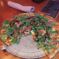 Arugula Di Parma Pizza · White pizza with fresh & dry mozzarella cooked then topped with an arugula salad, diced toma...