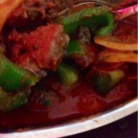 Kadhai Lamb · Lamb chunks cooked in a rich traditional curry sauce with big onion and bell pepper.