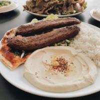 Lula Kabob Plate · Ground beef mixed with spices and grilled. Served with hummus, rice and salad.