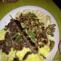 Meat Combo · Lamb, chicken and kafta (ground beef, parsley, onions and traditional spices) with flavored ...