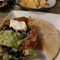 Quesadilla · Flour tortilla filled with Jack cheese and your choice of chicken or beef fajitas. Served wi...