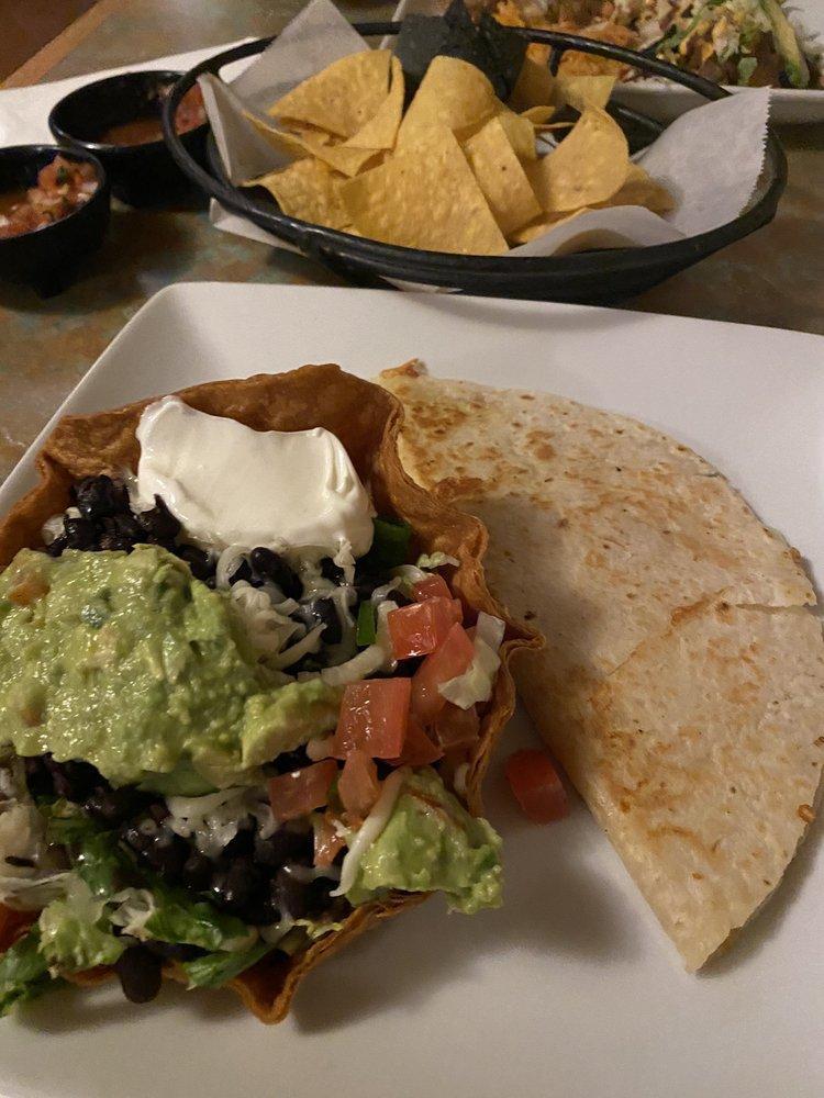 Quesadilla · Flour tortilla filled with Jack cheese and your choice of chicken or beef fajitas. Served with guacamole and sour cream.