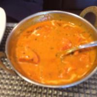 Chicken Tikka Masala · Tender chicken breast roasted in our clay oven, then simmered in a tomato and cream sauce.