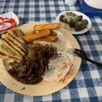Gyro Plate · Our gyro plate includes gyro meat, tzatziki, Greek salad, steak fries and pita. Served with ...